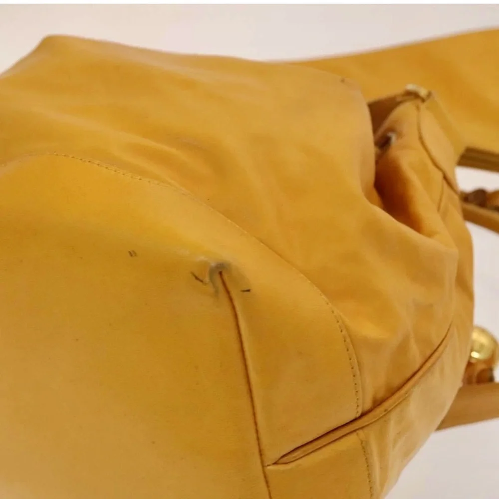 Authentic CHANEL yellow lambskin bucket bag with wallet pouch
